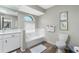 Bathroom with bathtub, toilet, and updated vanity at 10 Sportsman Pl, Rotonda West, FL 33947