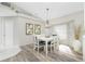 Bright dining room with white table and chairs, and large window at 10 Sportsman Pl, Rotonda West, FL 33947