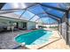 Enclosed kidney-shaped pool with patio at 10 Sportsman Pl, Rotonda West, FL 33947