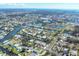 Aerial view showcasing the neighborhood's layout with canal access and a glimpse of the coastline at 1005 E 2Nd St, Englewood, FL 34223