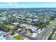 Wide angle, aerial view of a quiet residential neighborhood with canal access to the water at 1005 E 2Nd St, Englewood, FL 34223