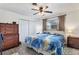 Comfortable bedroom with wood-look floors, a ceiling fan, and neutral paint at 1005 E 2Nd St, Englewood, FL 34223