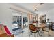 Dining area with a view of the pool through sliding glass doors at 1005 E 2Nd St, Englewood, FL 34223