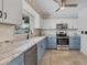 Bright kitchen featuring stainless steel appliances, granite countertops, and a window over the sink at 1005 E 2Nd St, Englewood, FL 34223