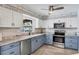 Well-lit kitchen with stainless steel appliances, granite countertops, modern cabinets and stylish backsplash at 1005 E 2Nd St, Englewood, FL 34223