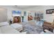Spacious living room with tile floors offers a relaxing space and is conveniently near the kitchen and dining areas at 1005 E 2Nd St, Englewood, FL 34223