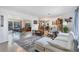 Bright living room is adjacent to the dining room and kitchen creating a welcoming open floor plan at 1005 E 2Nd St, Englewood, FL 34223