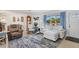 Bright living room with large windows, comfortable furniture and a welcoming atmosphere at 1005 E 2Nd St, Englewood, FL 34223