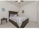 Spacious bedroom with a king-size bed and plenty of light at 11249 Mc Dermott Ct, Englewood, FL 34223