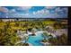 Large community pool with surrounding landscape at 11249 Mc Dermott Ct, Englewood, FL 34223