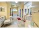 Bathroom featuring tiled floors, a bathtub, walk-in shower, vanity, and window for natural light at 1216 Whitney Dr, Venice, FL 34293