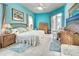 Serene bedroom with tile floors, turquoise walls, and a sliding glass door to the outdoor pool at 1216 Whitney Dr, Venice, FL 34293