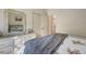 Bedroom featuring a bed with a floral patterned quilt and a dresser with a large mirror at 1216 Whitney Dr, Venice, FL 34293
