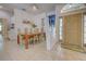 Elegant dining room with tile floors and view of the front door at 1216 Whitney Dr, Venice, FL 34293