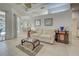 Spacious living room with tile flooring, neutral walls, and plenty of natural light at 1216 Whitney Dr, Venice, FL 34293