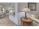 View of living room from the kitchen featuring a decorative lamp and neutral walls at 1216 Whitney Dr, Venice, FL 34293