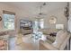 Bright living room featuring tile flooring, ceiling fan, and neutral color palette at 1216 Whitney Dr, Venice, FL 34293