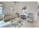 Bright living room showcasing tile flooring, neutral color palette, and contemporary decor at 1216 Whitney Dr, Venice, FL 34293