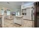 Open living area with tile floors and furniture at 1216 Whitney Dr, Venice, FL 34293