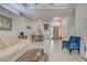 Bright living room features tile flooring, neutral walls, and an open floor plan at 1216 Whitney Dr, Venice, FL 34293
