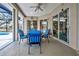 Covered patio featuring comfortable seating and multiple access points to the outdoors at 1216 Whitney Dr, Venice, FL 34293