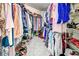 Spacious walk-in closet with ample shelving and hanging space for organized storage at 1216 Whitney Dr, Venice, FL 34293