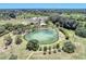Aerial view of Warm Mineral Springs with people swimming at 1312 Wasilla St, North Port, FL 34291