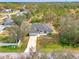 Aerial view of a house with a driveway and neighborhood setting at 1312 Wasilla St, North Port, FL 34291