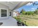 Covered patio with view of backyard, ideal for relaxing at 1312 Wasilla St, North Port, FL 34291