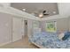 Spacious bedroom with ceiling fan and window at 1312 Wasilla St, North Port, FL 34291