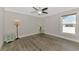 Serene bedroom featuring wood-look floors and dual bedside lamps at 1312 Wasilla St, North Port, FL 34291