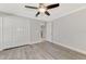Spacious bedroom with wood-look floors and double doors at 1312 Wasilla St, North Port, FL 34291