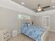 Main bedroom with ceiling fan and window at 1312 Wasilla St, North Port, FL 34291