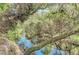 Serene waterway flows through lush foliage in a natural park setting at 1312 Wasilla St, North Port, FL 34291