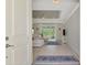 Bright and spacious entryway leading to living room with a view at 1312 Wasilla St, North Port, FL 34291