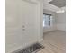 Open concept entryway with double doors and light flooring at 1312 Wasilla St, North Port, FL 34291