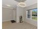 Light and airy entryway with a small plant stand at 1312 Wasilla St, North Port, FL 34291