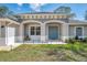Two-story home with double doors and a welcoming porch at 1312 Wasilla St, North Port, FL 34291