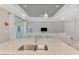 Kitchen island with double sink overlooking living room at 1312 Wasilla St, North Port, FL 34291