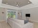 Spacious living room with coffered ceiling, sliding doors to patio at 1312 Wasilla St, North Port, FL 34291