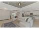 Open living space featuring a large sectional sofa and modern ceiling fan at 1312 Wasilla St, North Port, FL 34291