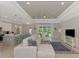 Open concept living room, kitchen and dining area with high ceilings at 1312 Wasilla St, North Port, FL 34291