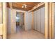 Bedroom featuring tile flooring, exposed wall studs, and a doorway leading to an adjoining space at 1340 Holiday Dr, Englewood, FL 34223