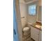 Bathroom featuring tiled shower, vanity with storage, and toilet at 1449 Deer Creek Dr, Englewood, FL 34223