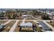 Aerial view of a compact residential community, showcasing tidy lawns and convenient street access, surrounded by lush greenery and waterways at 1455 New Point Comfort Rd, Englewood, FL 34223
