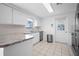 Updated kitchen featuring stainless steel appliances, tile floors and backsplash at 1455 New Point Comfort Rd, Englewood, FL 34223