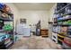 Laundry room with washer, dryer, shelving, and water heater at 1493 New Point Comfort Rd, Englewood, FL 34223