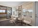 Comfortable sunroom featuring a glass table and three chairs at 1493 New Point Comfort Rd, Englewood, FL 34223