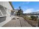 Backyard featuring a mix of stone and concrete and a fence with view of the lake at 1495 New Point Comfort Rd, Englewood, FL 34223