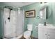 Bathroom with a shower, toilet, vanity, and decor at 1495 New Point Comfort Rd, Englewood, FL 34223